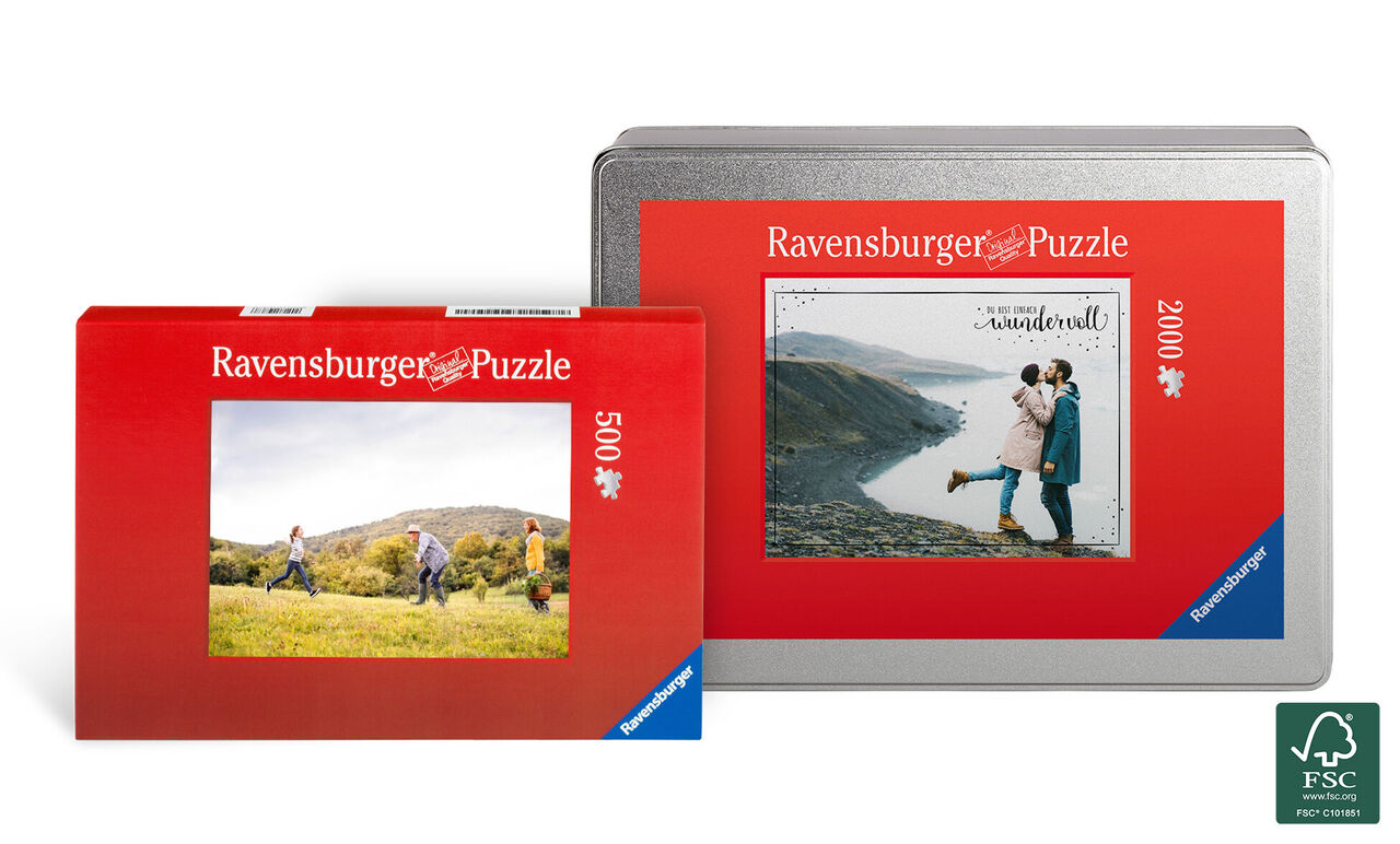 Deux puzzles Ravensburger dans des emballages rouges, l'un montrant un couple en montagne, l'autre un paysage.