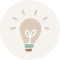 Une ampoule simple et stylisée avec une base verte et un cœur dans le filament.
